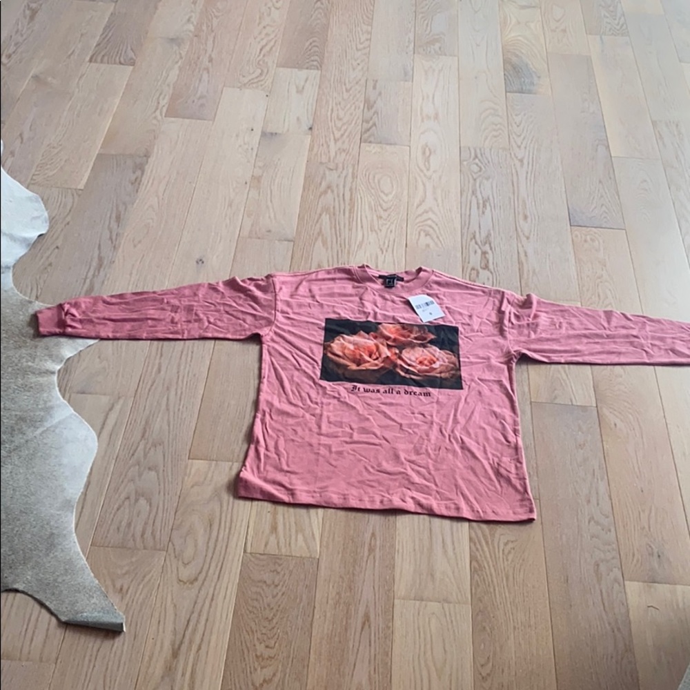 A pink long sleeve warm top